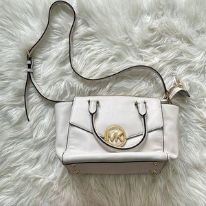 White Michael Kors purse with front and back pockets, zippered pocket inside